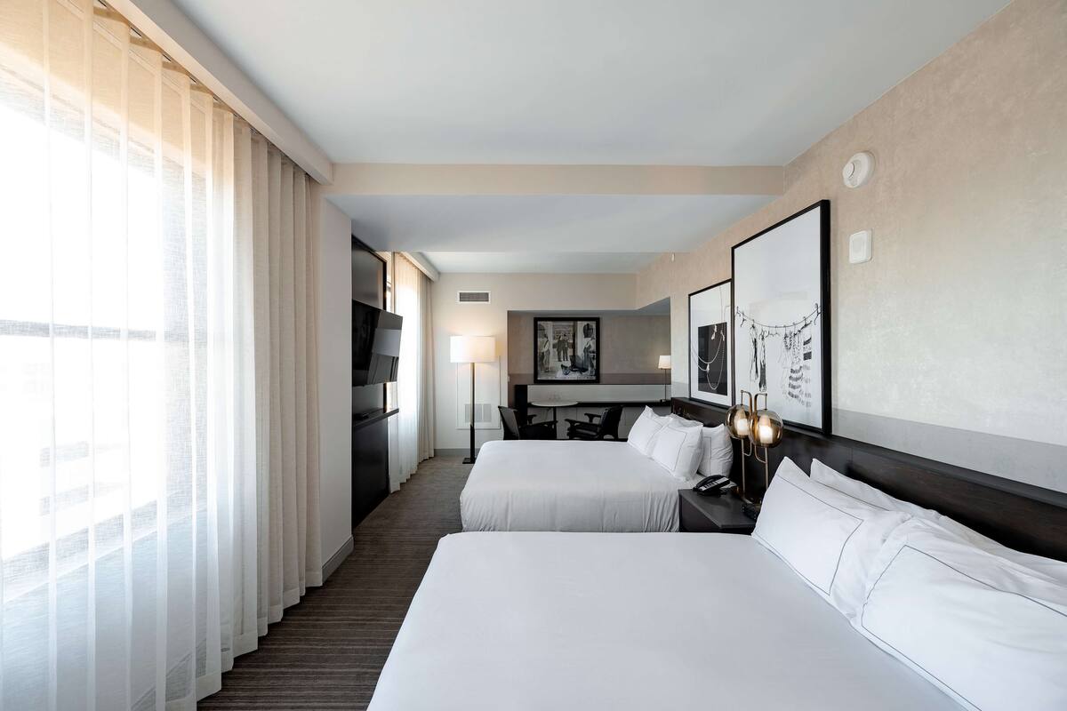 premium bedding, laptop workspace, iron/ironing board