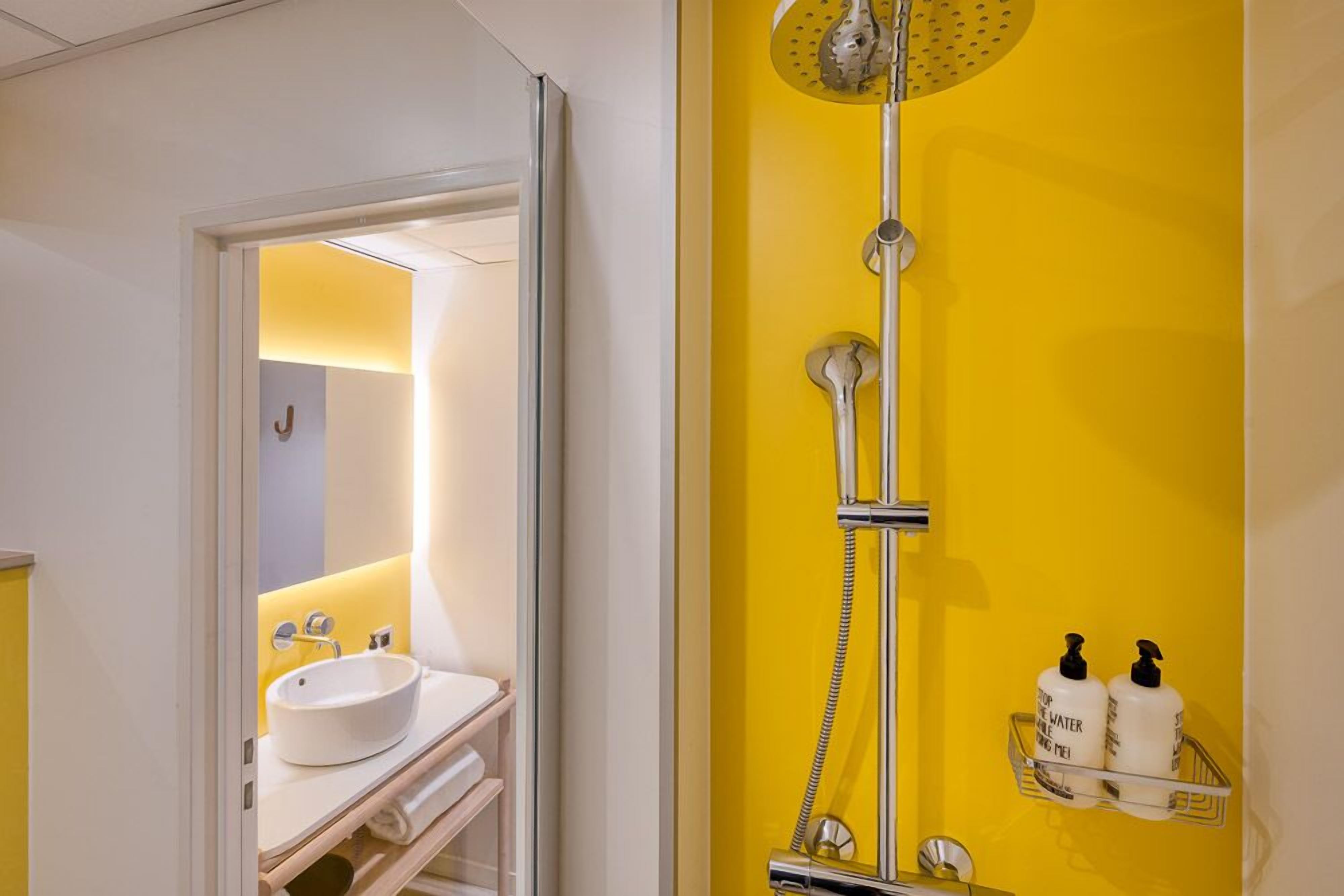 superior double room | bathroom | shower, hair dryer, towels, soap