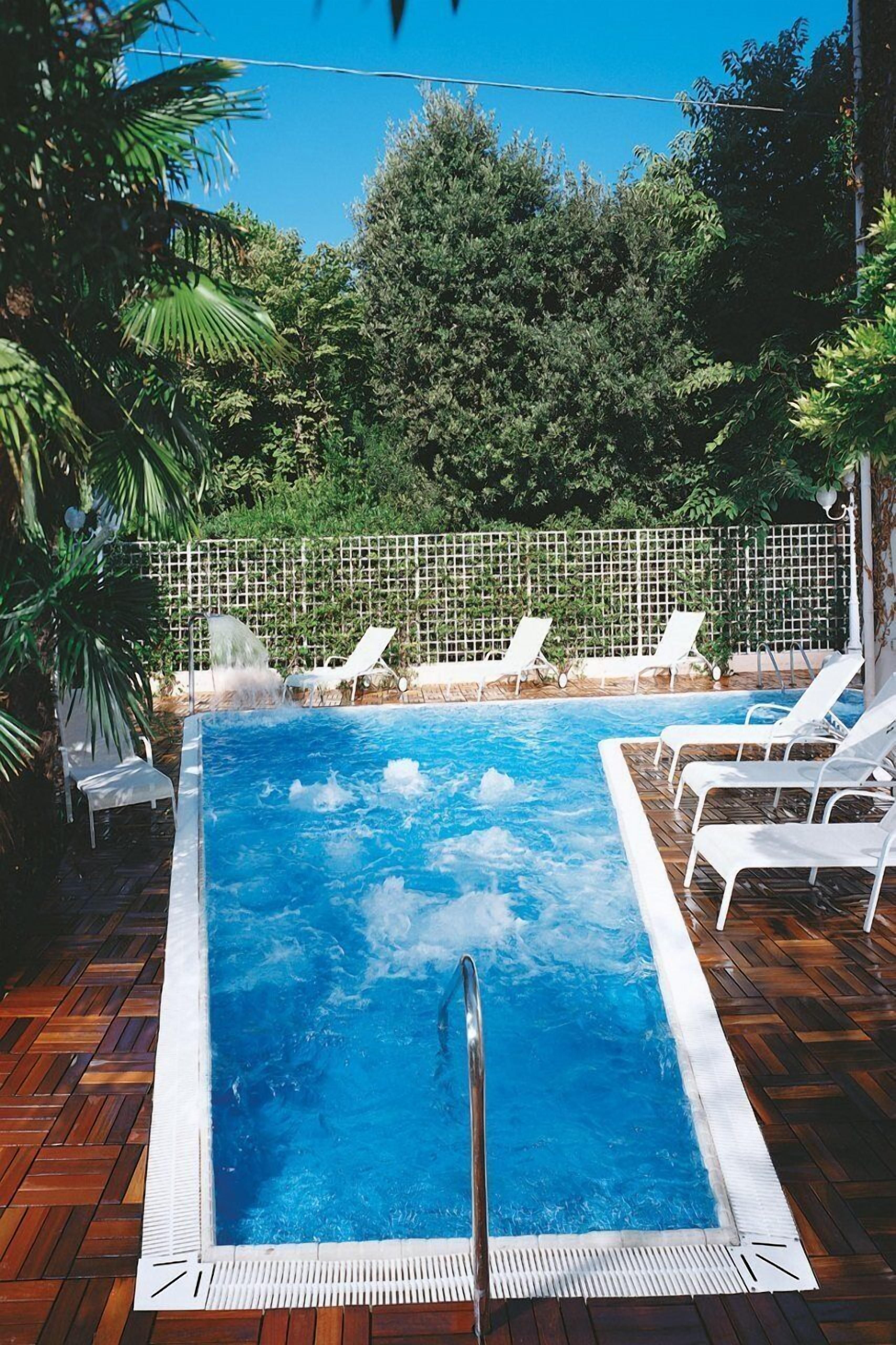 Indoor pool, outdoor pool, open 9:30 AM to 7 PM, pool loungers