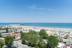 On the beach, sun-loungers, beach umbrellas, beach towels