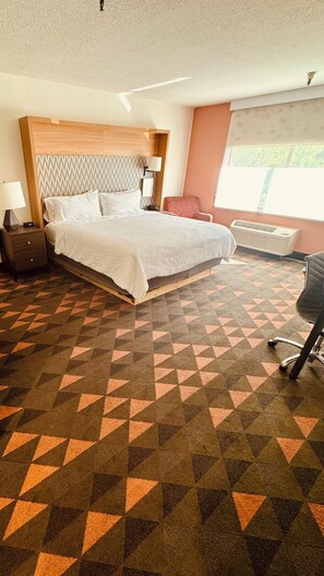 Premium bedding, desk, laptop workspace, iron/ironing board