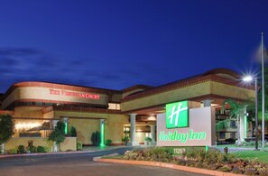 A Holiday Inn hotel with a large sign, multiple floors, and a fire lane with no parking. - Holiday Inn Rancho Cordova by IHG (Rancho Cordova)