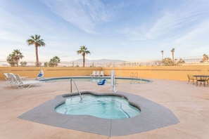 Outdoor pool, open 10 AM to 11 PM, pool loungers