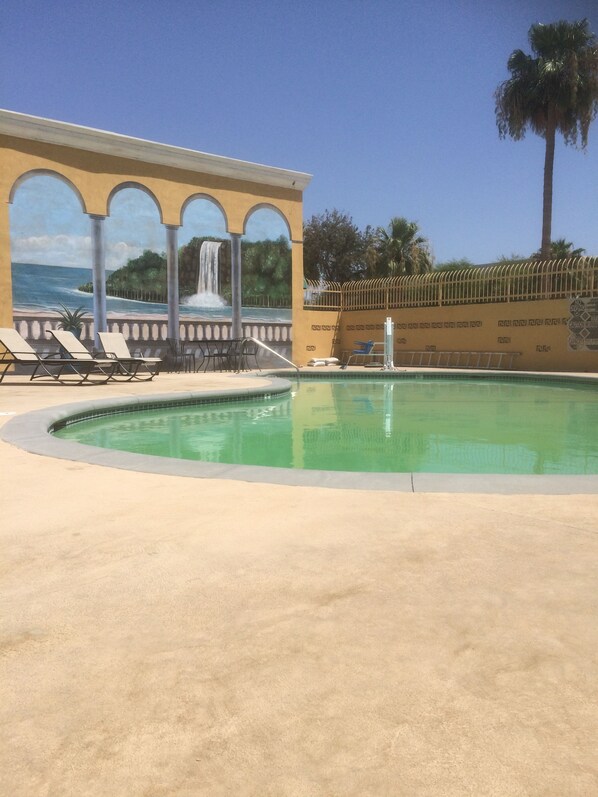 Outdoor pool, open 10 AM to 11 PM, pool loungers