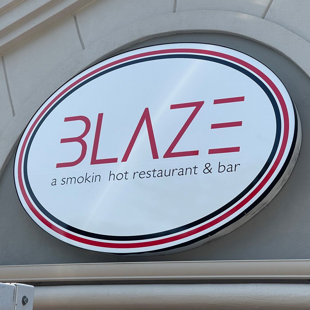 A sign for Blaze, a smokin' hot restaurant & bar.