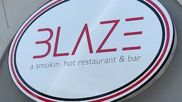 A sign for Blaze, a smokin' hot restaurant & bar.