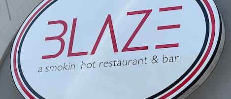 A sign for Blaze, a smokin' hot restaurant & bar.