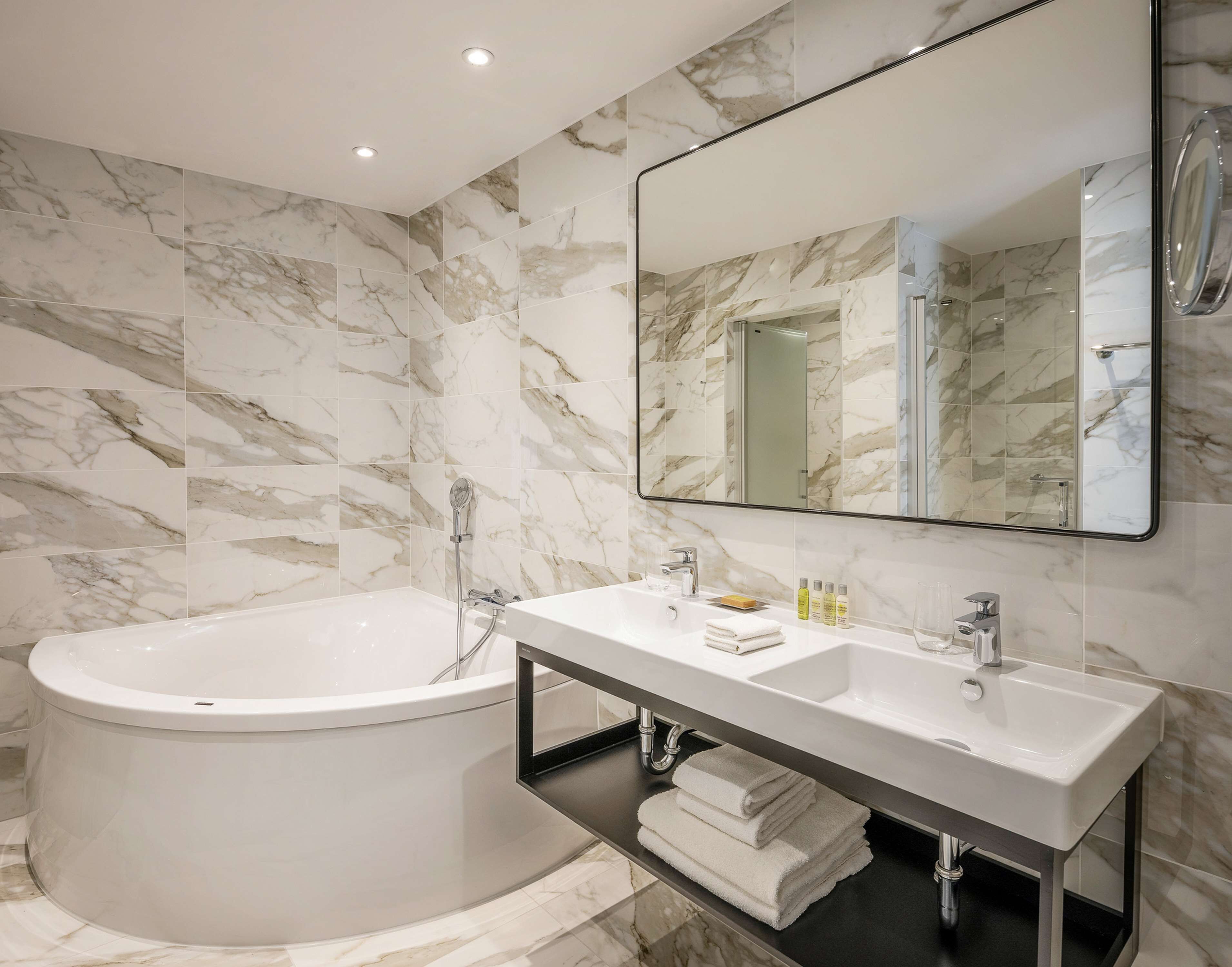 family suite, 1 king bed | bathroom | eco-friendly toiletries, hair dryer, towels