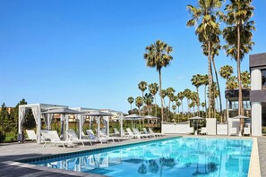 Outdoor pool, open 6:00 AM to 10:00 PM, free pool cabanas
