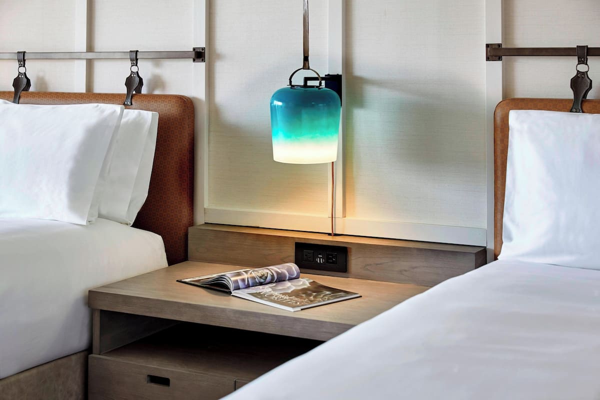 Down comforters, pillowtop beds, in-room safe, desk