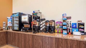A coffee station with multiple coffee machines, a yogurt dispenser, and various beverage dispensers.