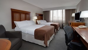 A hotel room with two beds, a desk with a computer, a chair, and a TV. - Holiday Inn Bangor by IHG (Bangor)