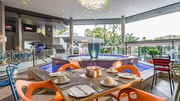 Enjoy a romantic meal in our beautifully designed outdoor dining area, featuring a stylish table for two, decorative water feature, and stunning views.