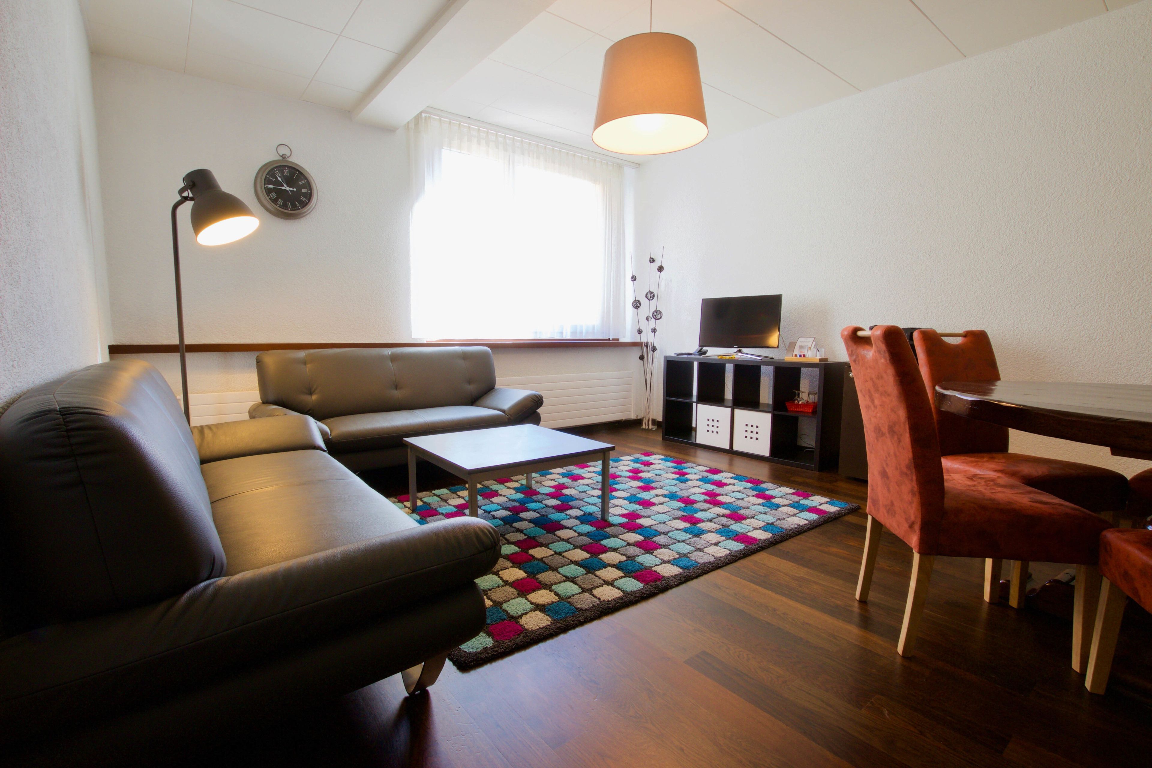 family room | minibar, in-room safe, desk, iron/ironing board