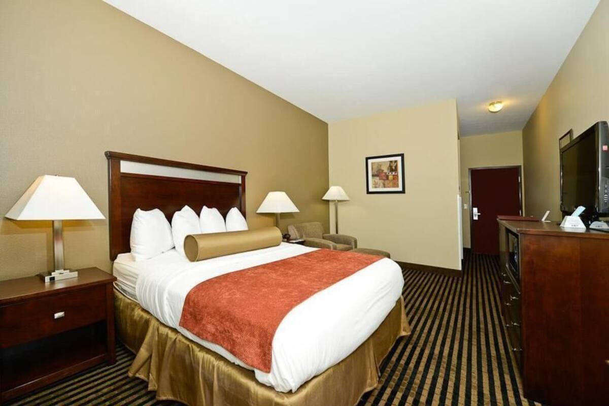 Premium bedding, desk, laptop workspace, blackout curtains