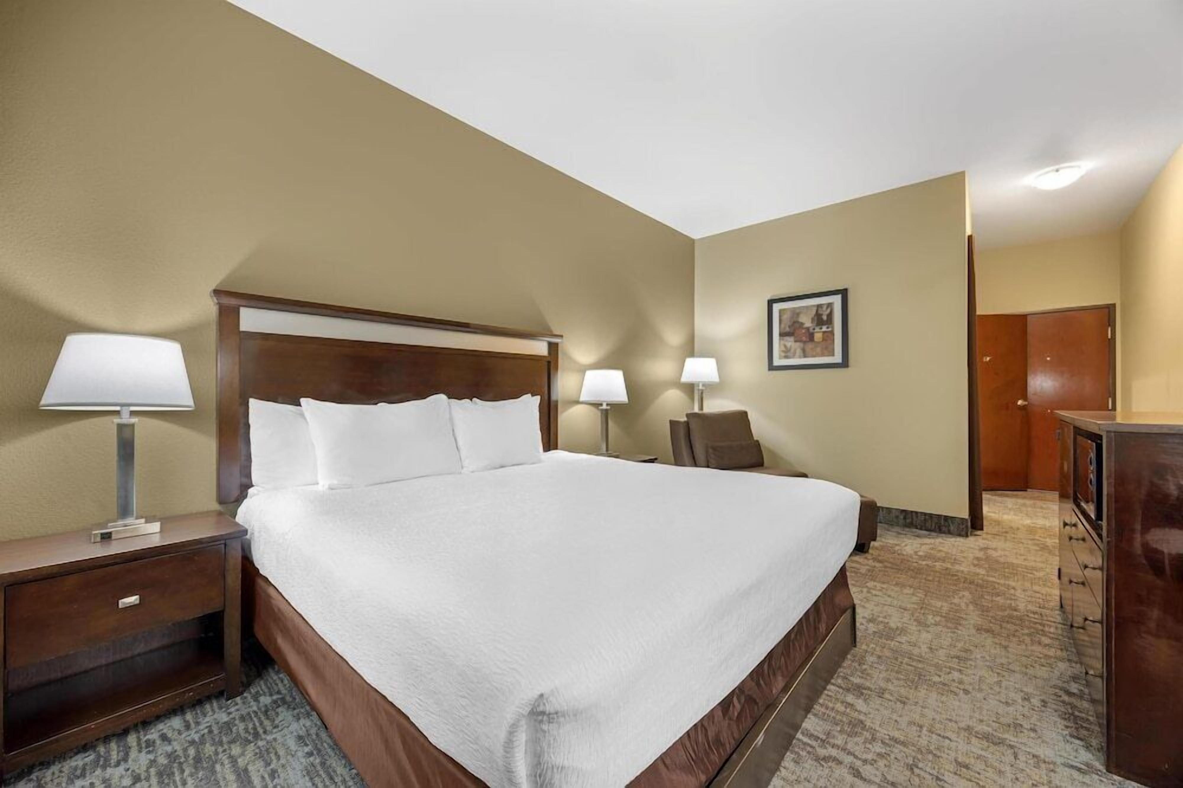 Premium bedding, desk, laptop workspace, blackout curtains