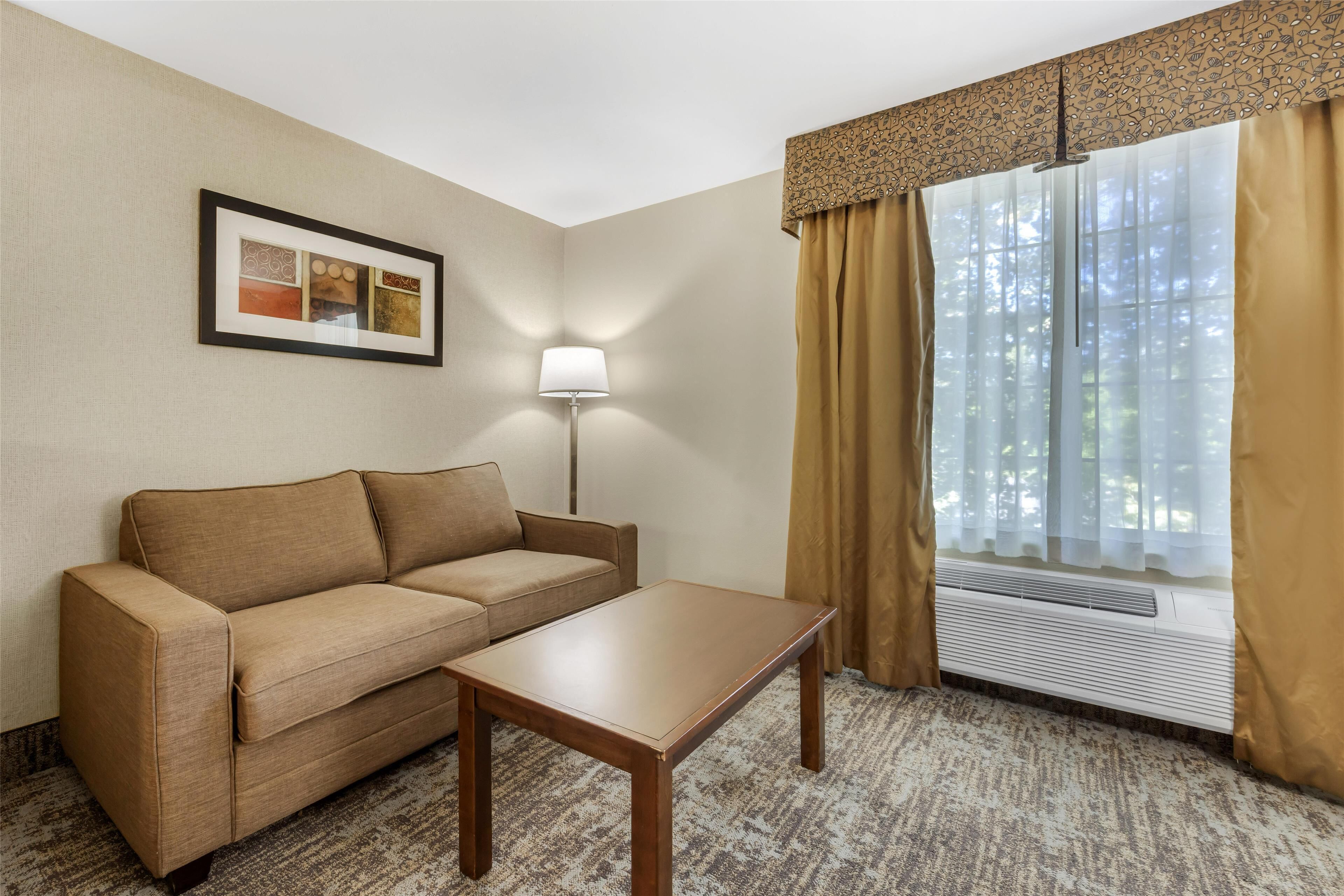 suite, 1 king bed, non smoking, jetted tub (with sofabed) | premium bedding, desk, laptop workspace, blackout curtains