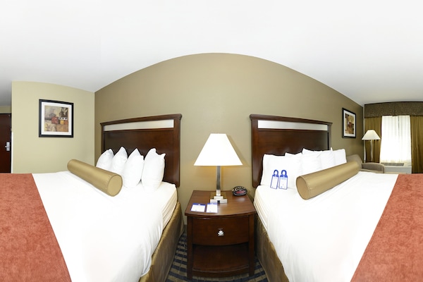 Premium bedding, desk, laptop workspace, blackout curtains