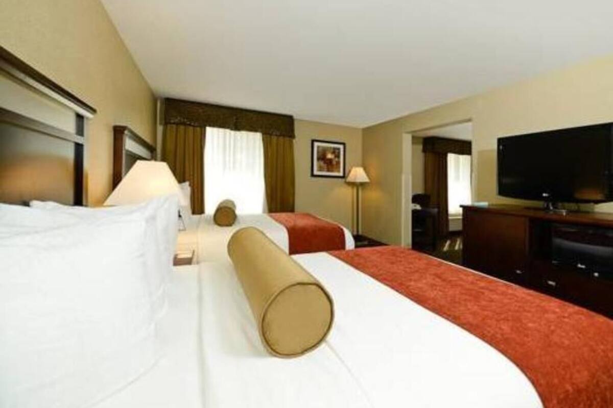 Premium bedding, desk, laptop workspace, blackout curtains