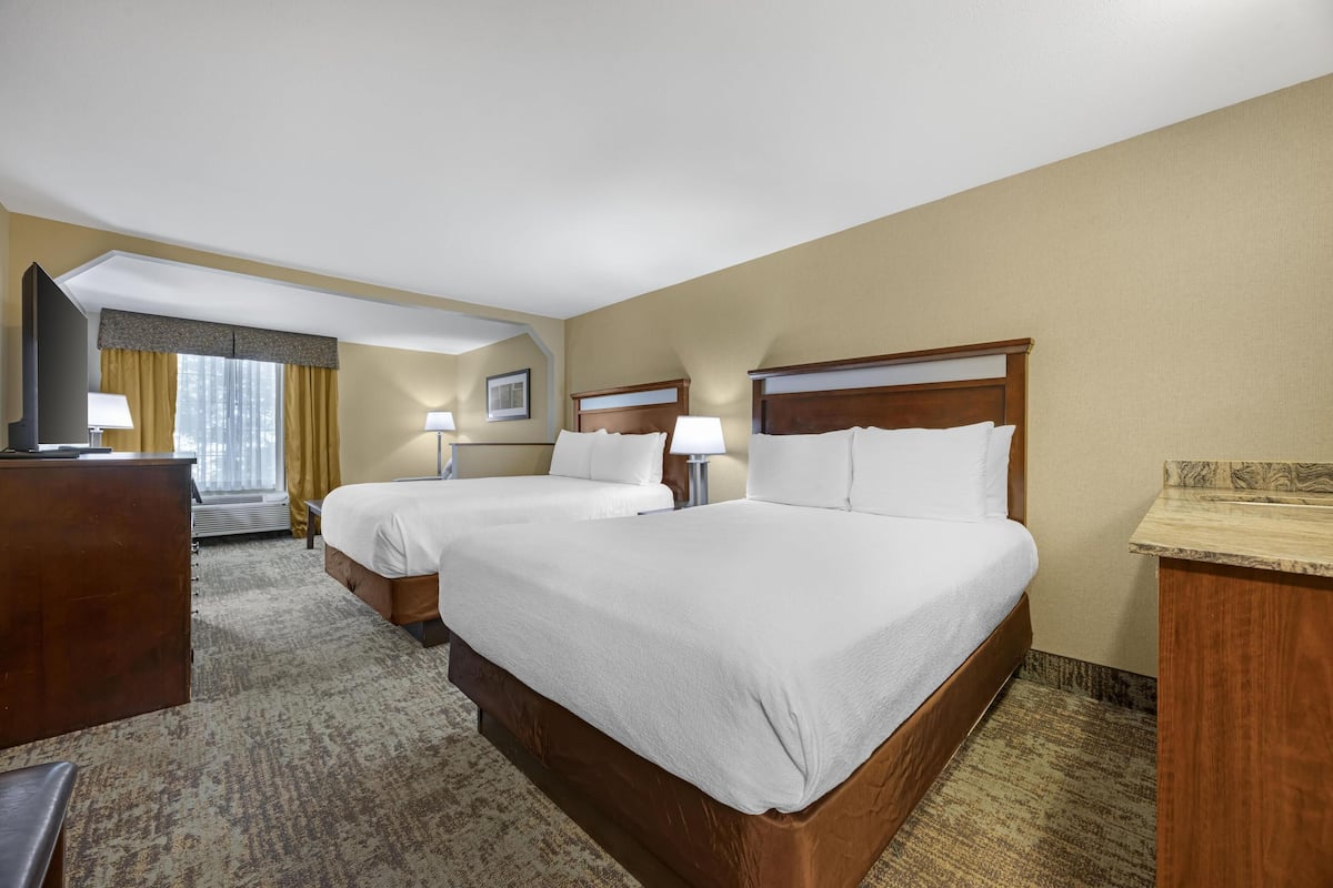 Premium bedding, desk, laptop workspace, blackout curtains