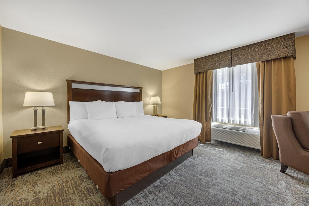 Premium bedding, desk, laptop workspace, blackout curtains