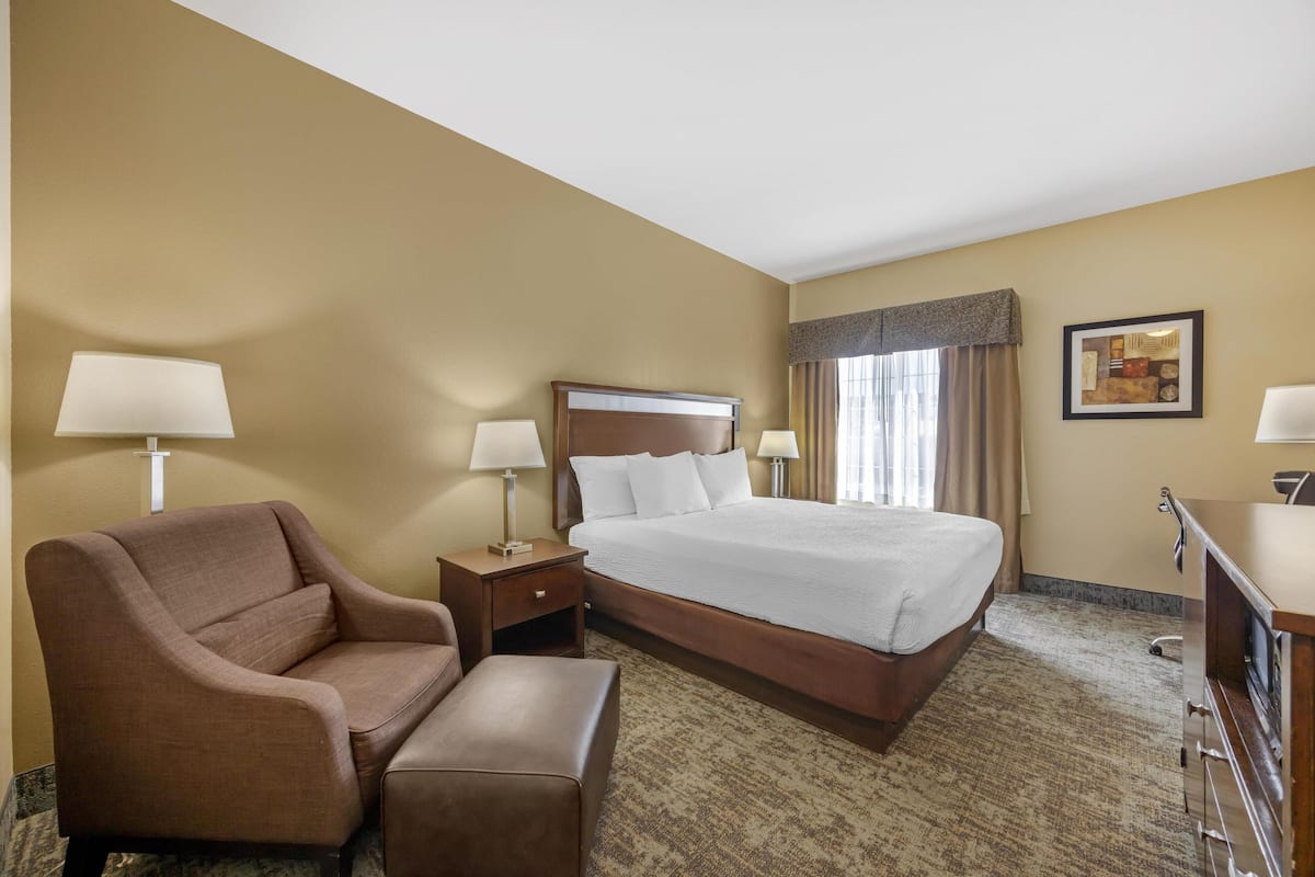 Premium bedding, desk, laptop workspace, blackout curtains