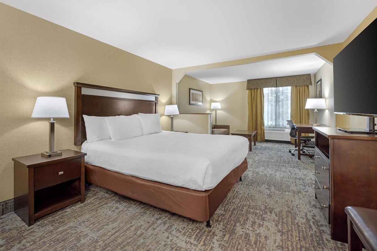 Premium bedding, desk, laptop workspace, blackout curtains