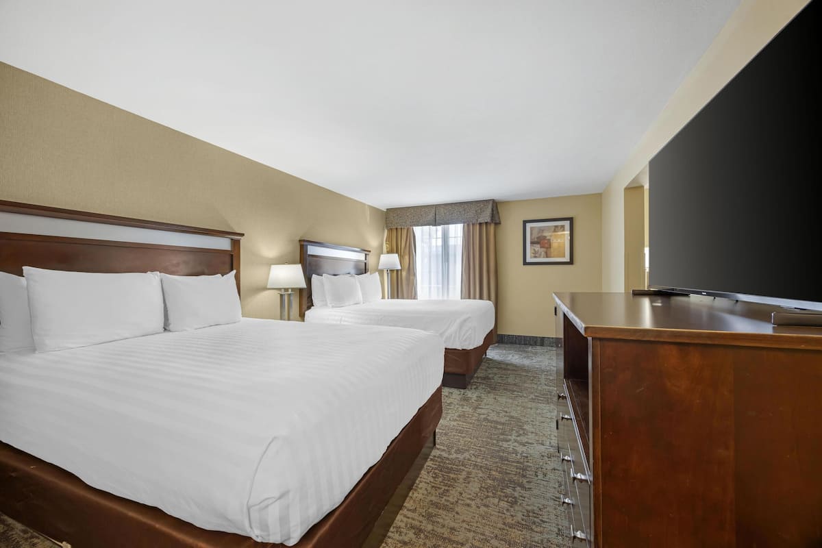 Premium bedding, desk, laptop workspace, blackout curtains