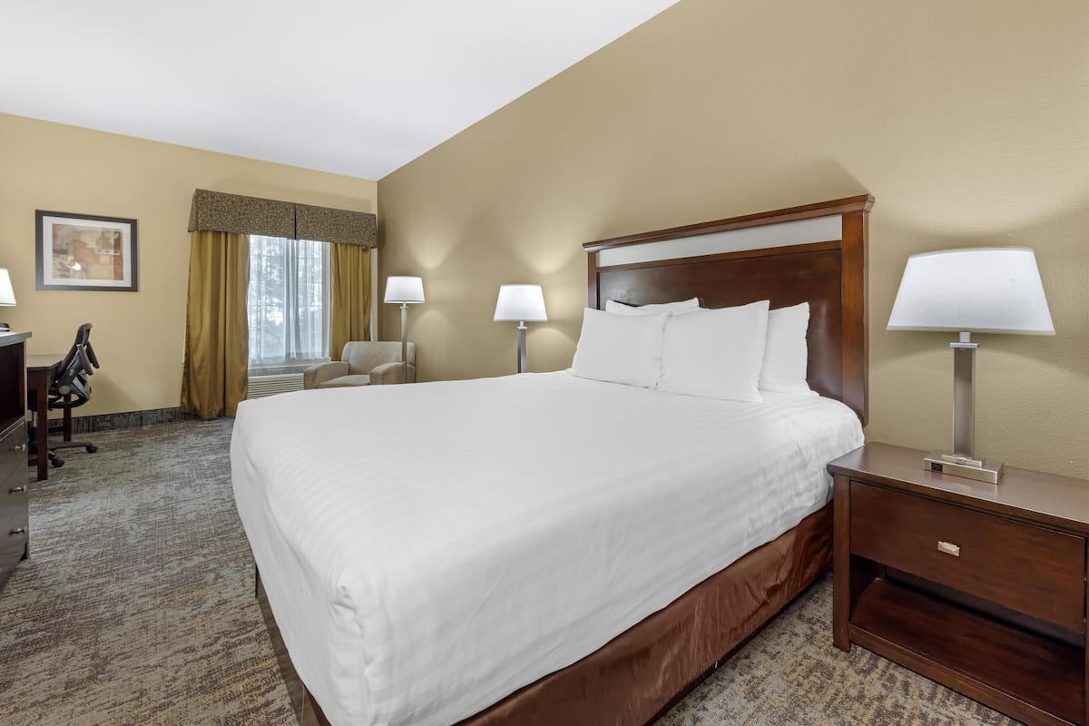Premium bedding, desk, laptop workspace, blackout curtains