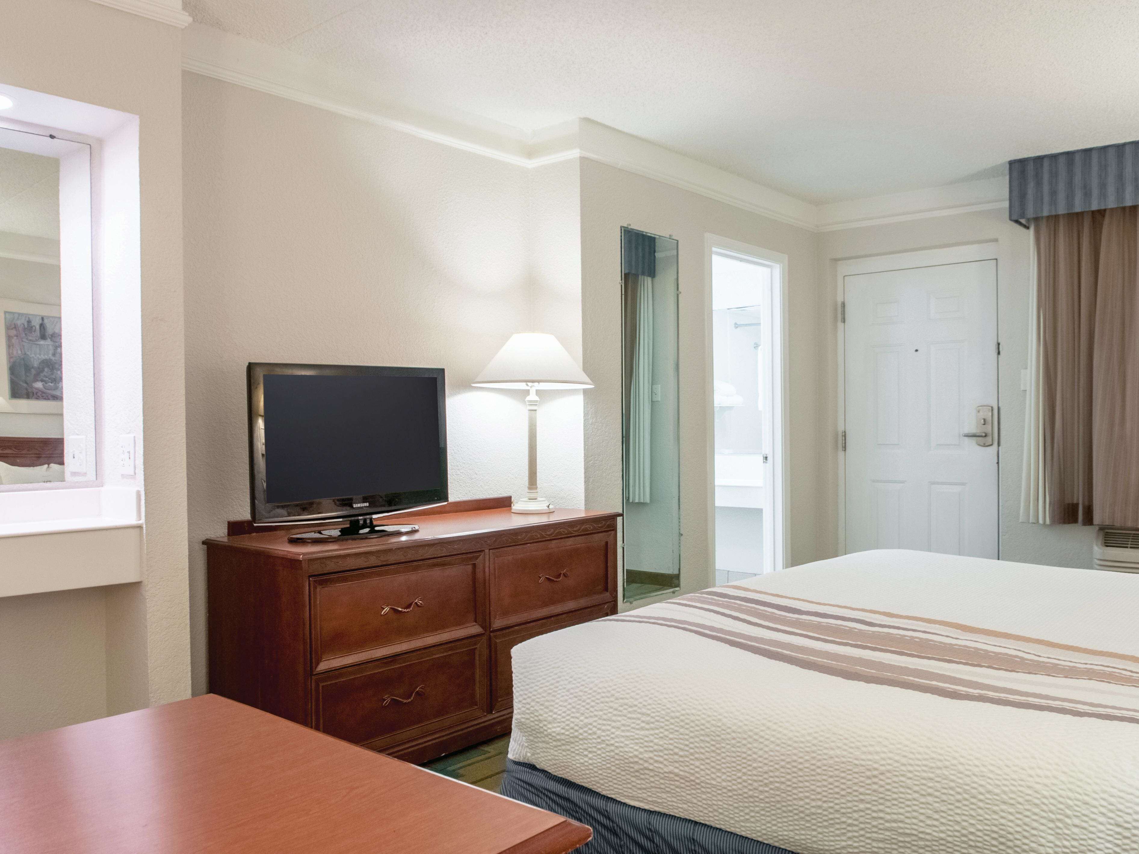 premium bedding, desk, laptop workspace, iron/ironing board