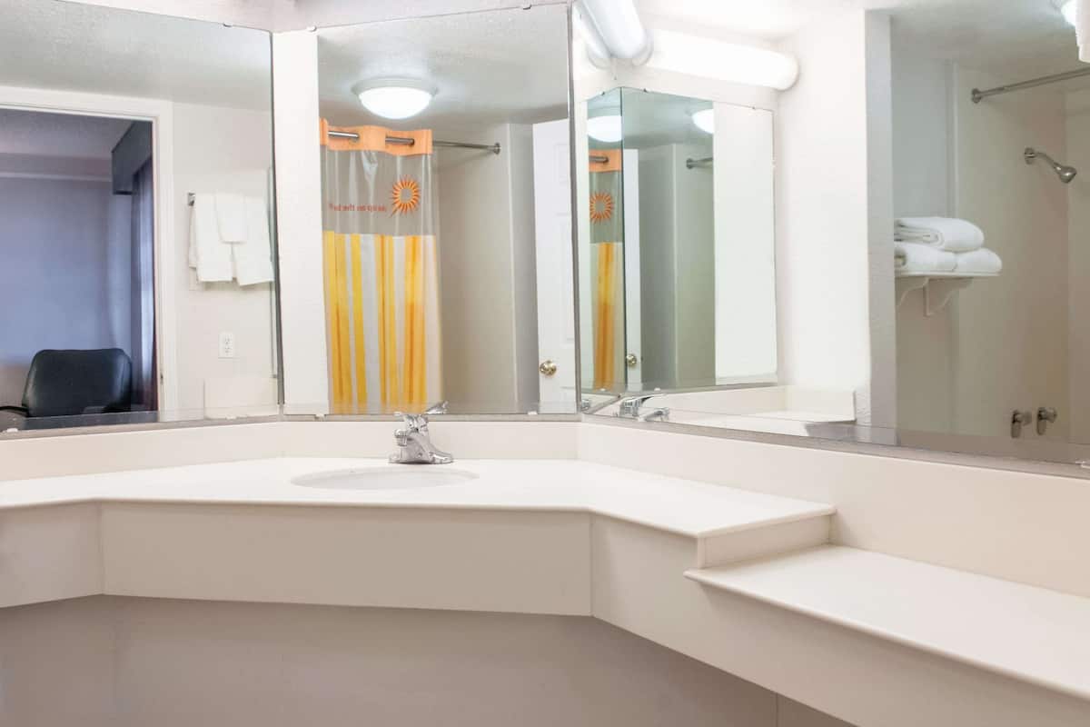 premium bedding, desk, laptop workspace, iron/ironing board