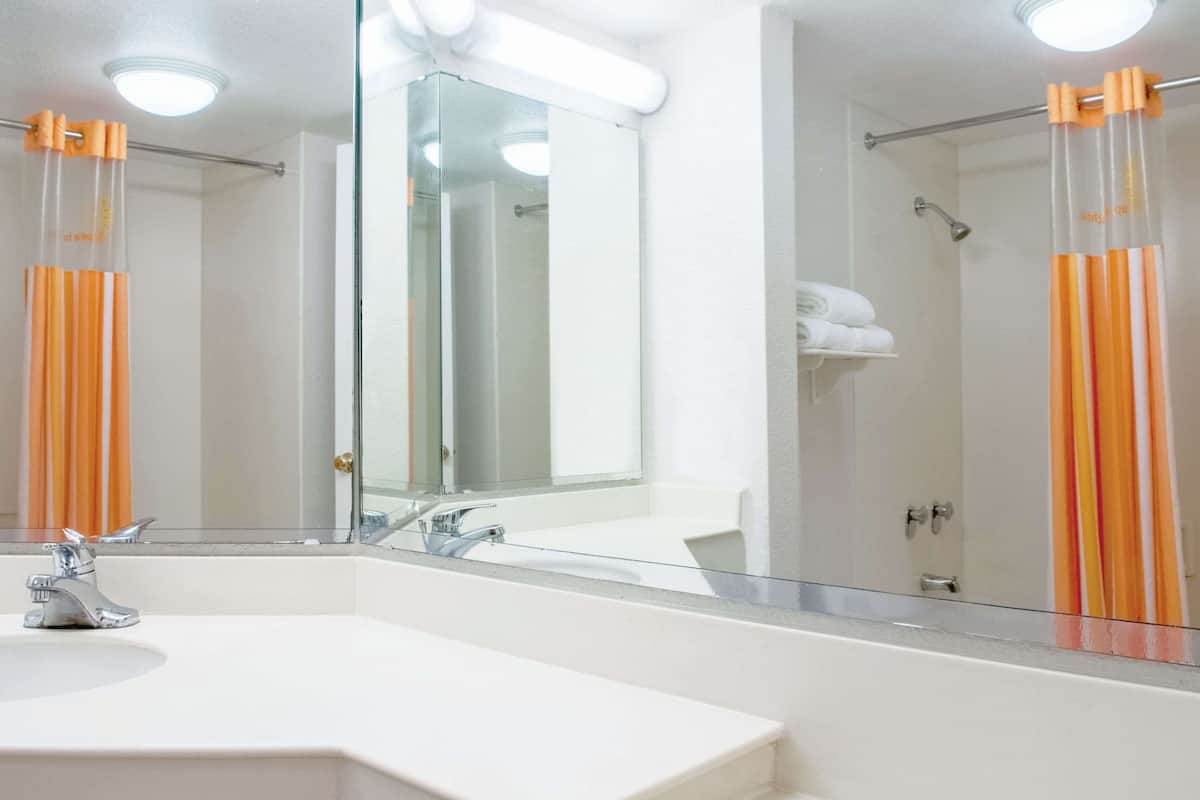 premium bedding, desk, laptop workspace, iron/ironing board