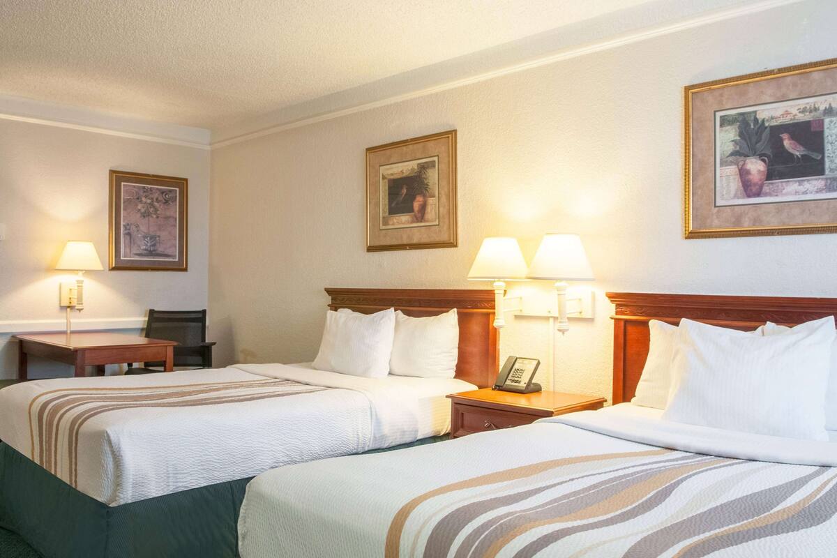 premium bedding, desk, laptop workspace, iron/ironing board