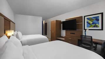Premium bedding, desk, laptop workspace, blackout drapes