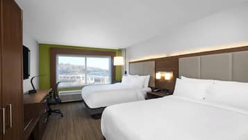 Premium bedding, desk, laptop workspace, blackout drapes