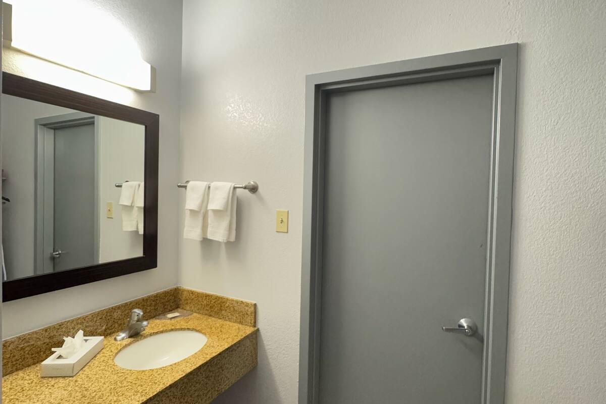 eco-friendly toiletries, hair dryer, towels