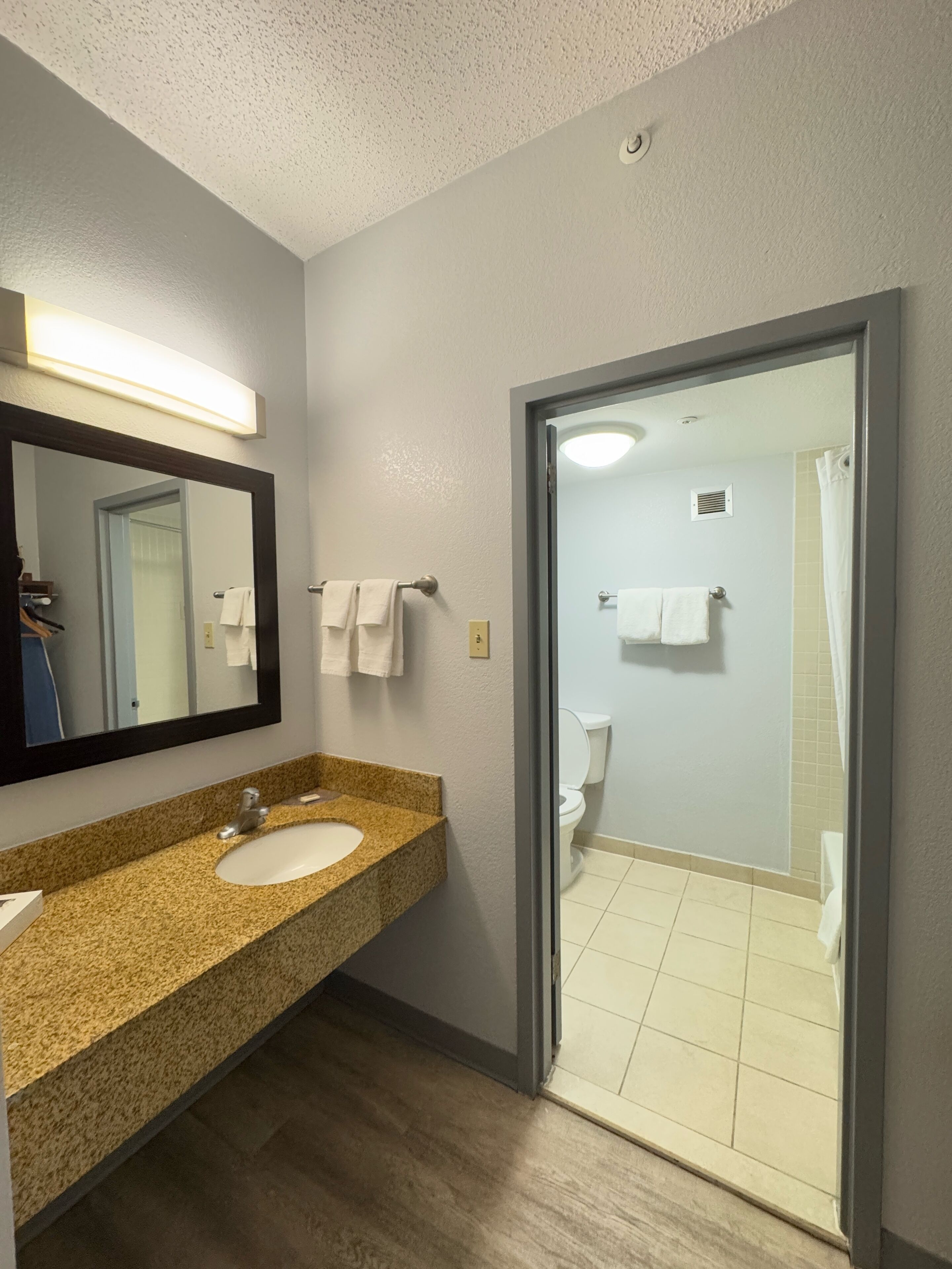 eco-friendly toiletries, hair dryer, towels