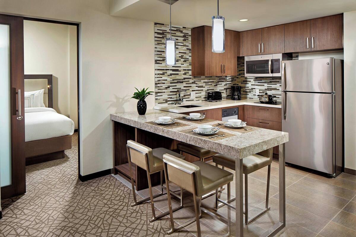 full-sized fridge, microwave, stovetop, dishwasher