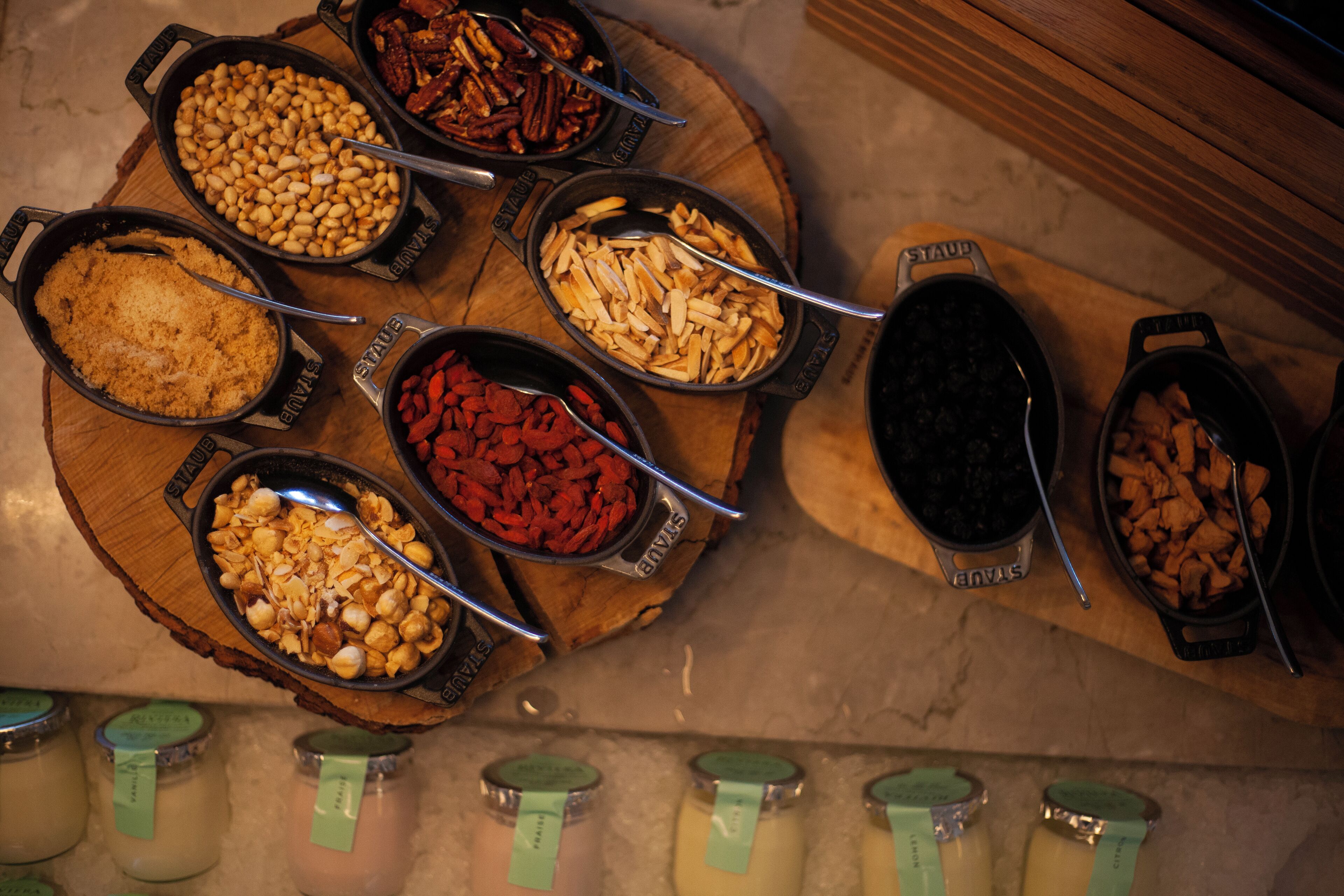 A buffet with various food items and condiments.
