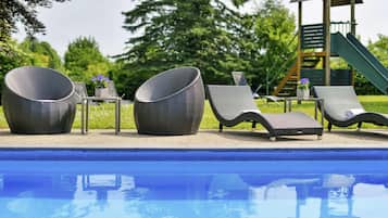 Seasonal outdoor pool, pool loungers