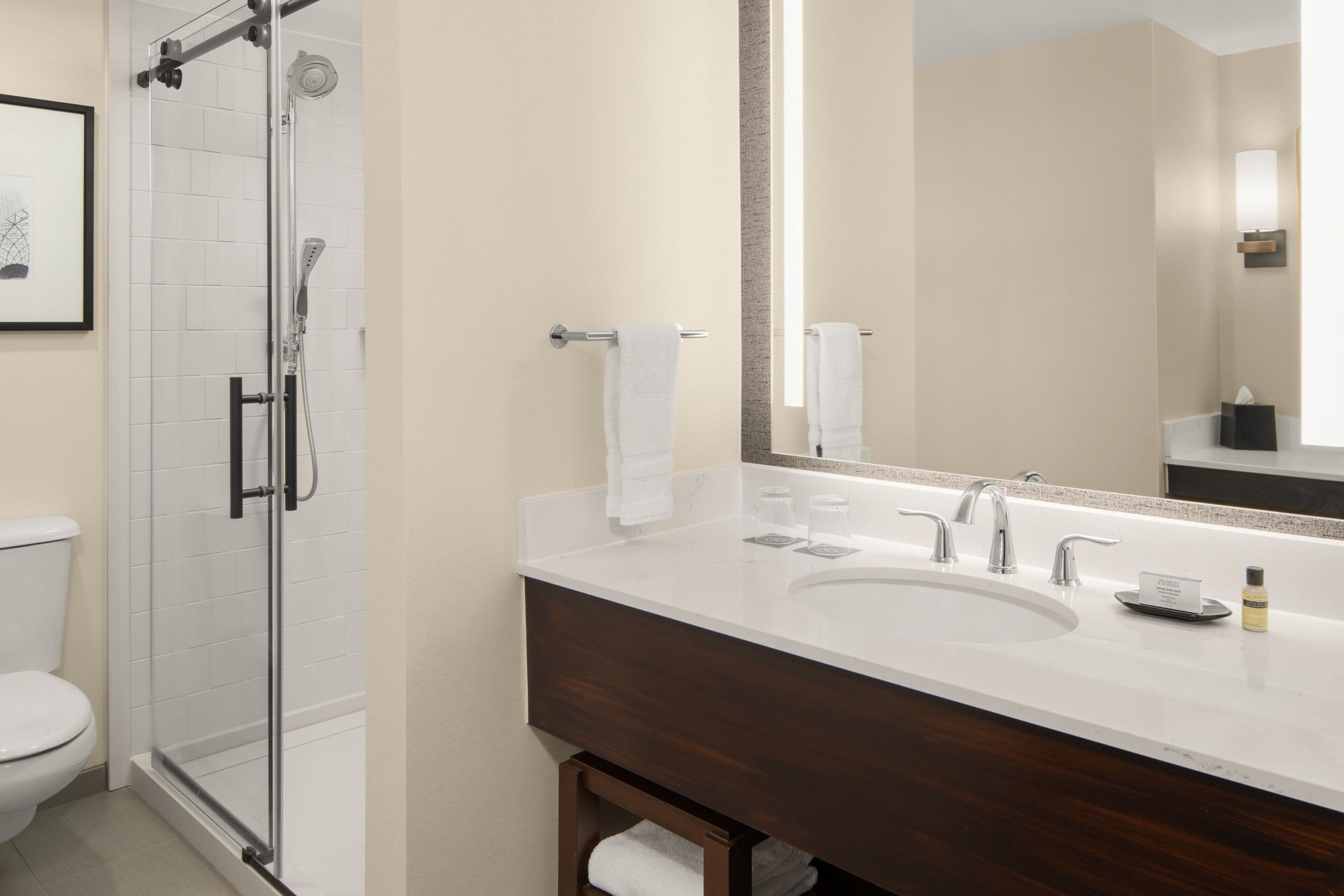 Combined shower/tub, designer toiletries, hair dryer, towels