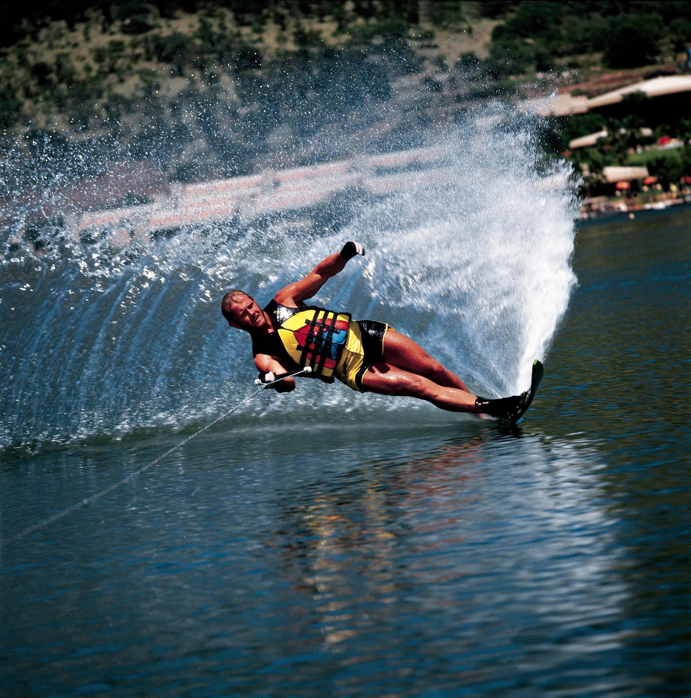 A person water skiing on a river.