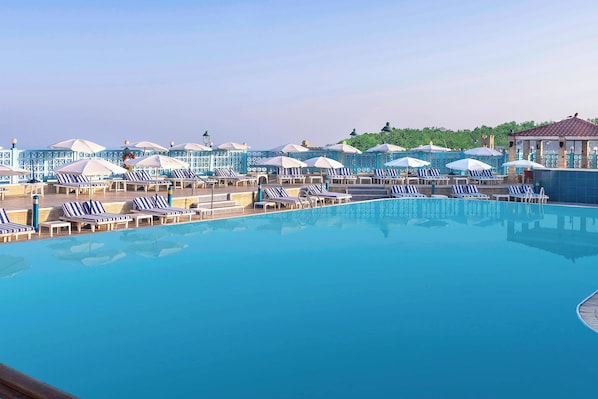 Outdoor pool, open 9:00 AM to 6:00 PM, pool umbrellas, sun loungers