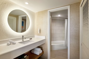Combined shower/tub, free toiletries, hair dryer, towels at Embassy Suites by Hilton Deerfield Beach Resort & Spa