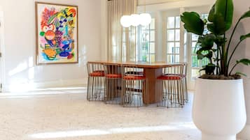 Enjoy meals in this inviting dining area with a wooden table and six comfortable chairs.