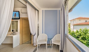 Comfort Triple Room, Private Bathroom | Minibar, in-room safe, desk, blackout curtains