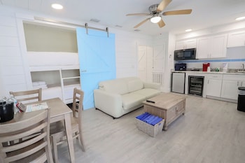 Siesta Bunkhouse - 1 Bedroom | Living area | 50-inch TV with cable channels at Siesta Key Beach Resort and Suites