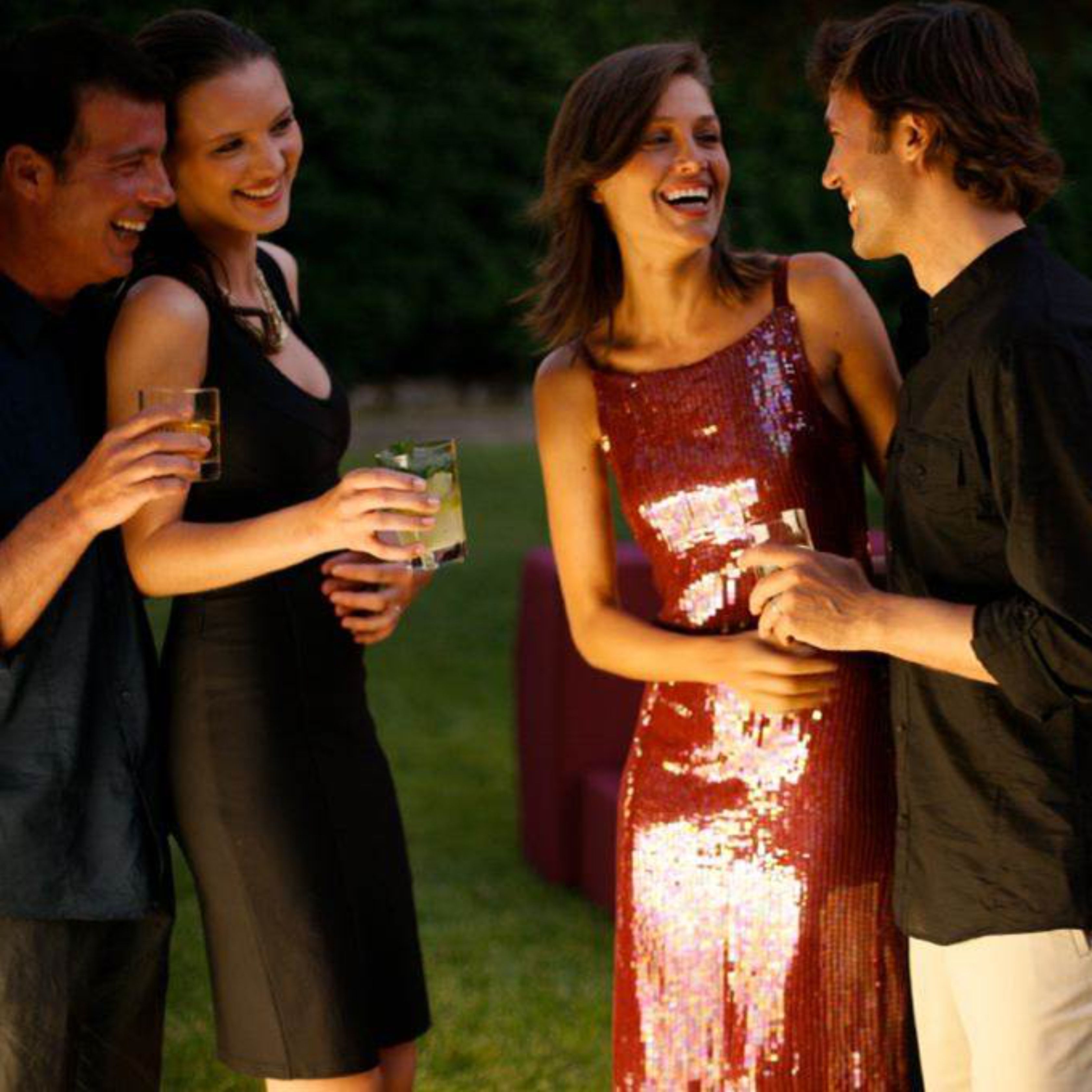 A group of people at an outdoor event, possibly a party or celebration.