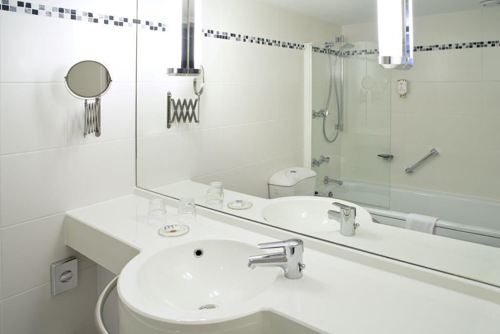 eco-friendly toiletries, hair dryer, towels