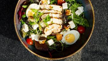 A bowl of salad with various ingredients.